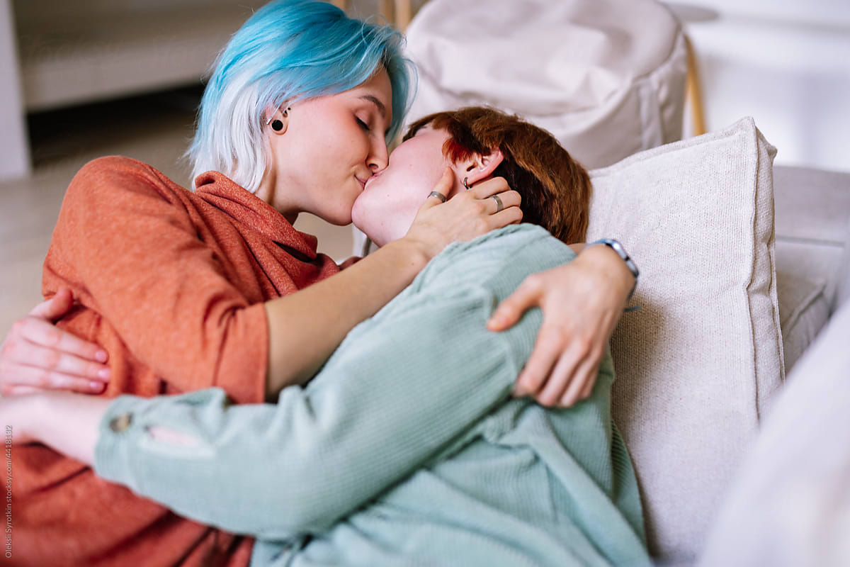 Women enjoying intimacy in bedroom