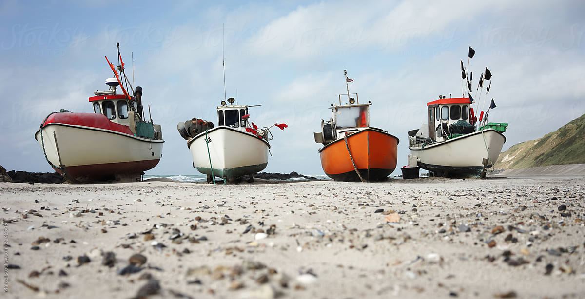 Old Fishing Boats On The Beach In Denmark by Stocksy Contributor