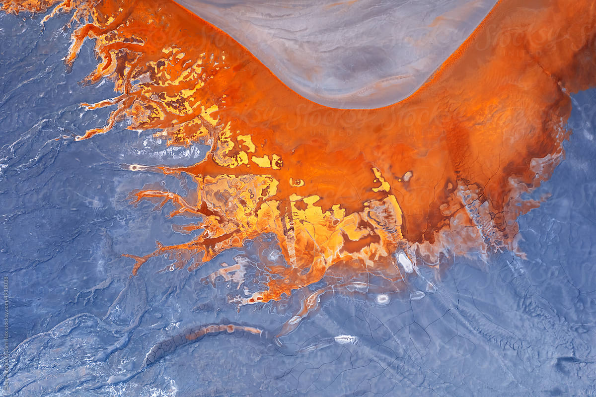 Top view of abstract rivers with vibrant orange and blue colors