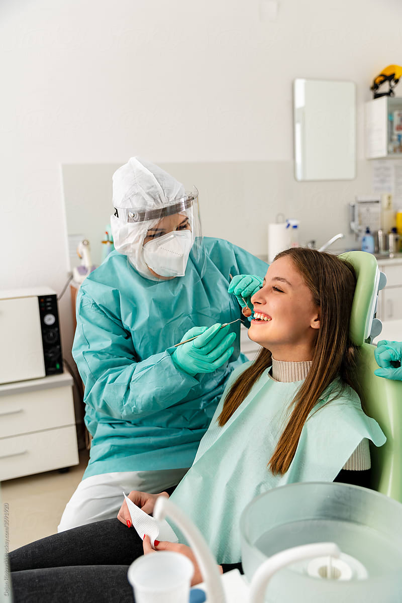 Dentist  working on a patient at the dental clinic