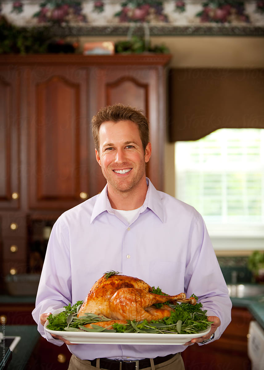 Thanksgiving: Man Holding Platter with Roast Turkey