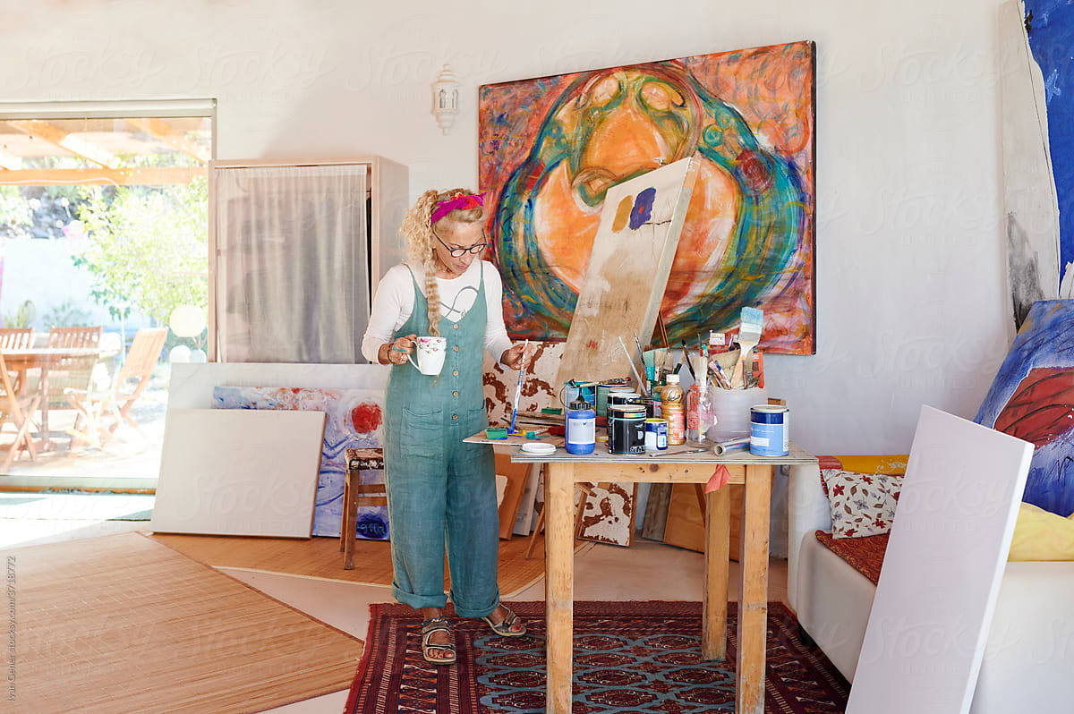 Senior woman working alone in her painting studio