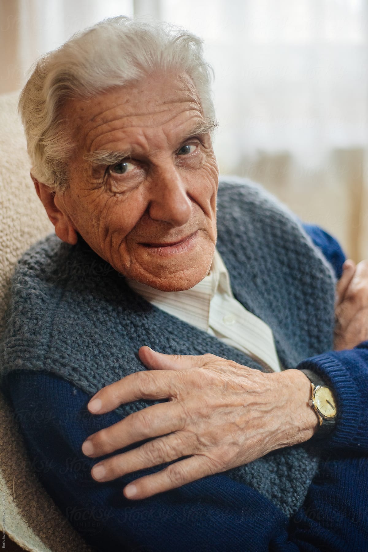 Portrait of senior man in sweater and shirt