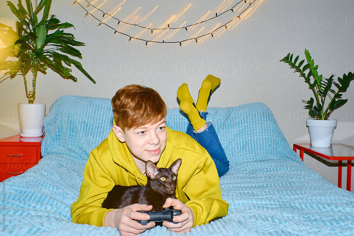 a teenager with a gamepad