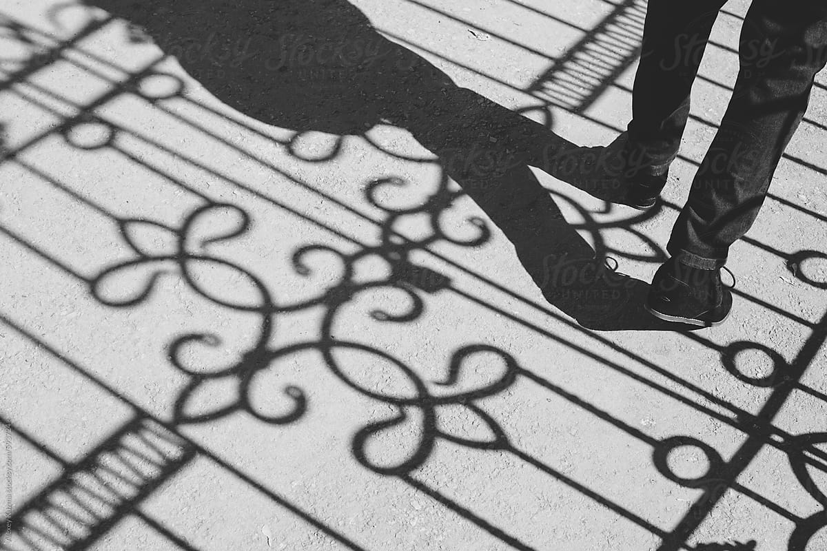 woman walking on the street and shadows