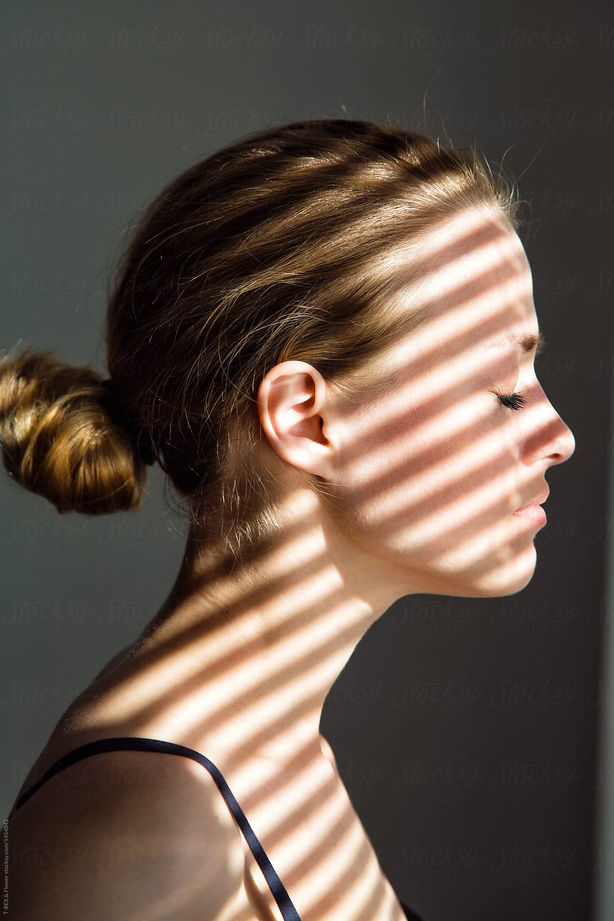 Woman with shadow lines on face
