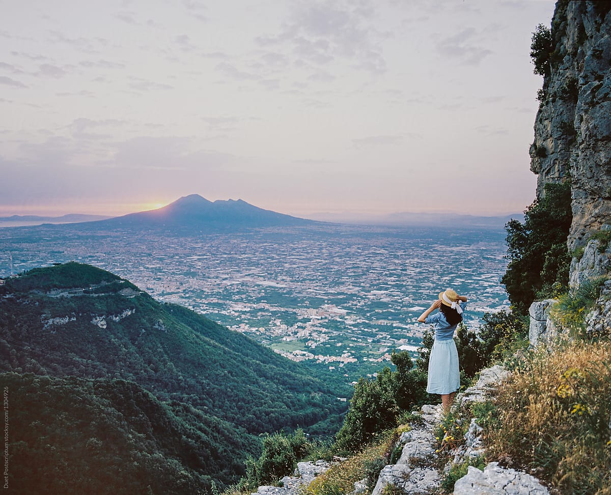 Woman looking at volcano landscape
