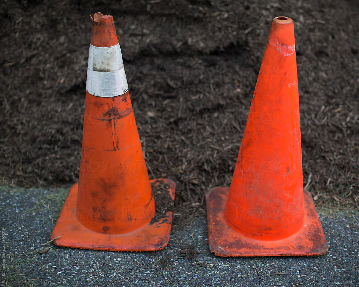 Traffic cones, pile of compost behind