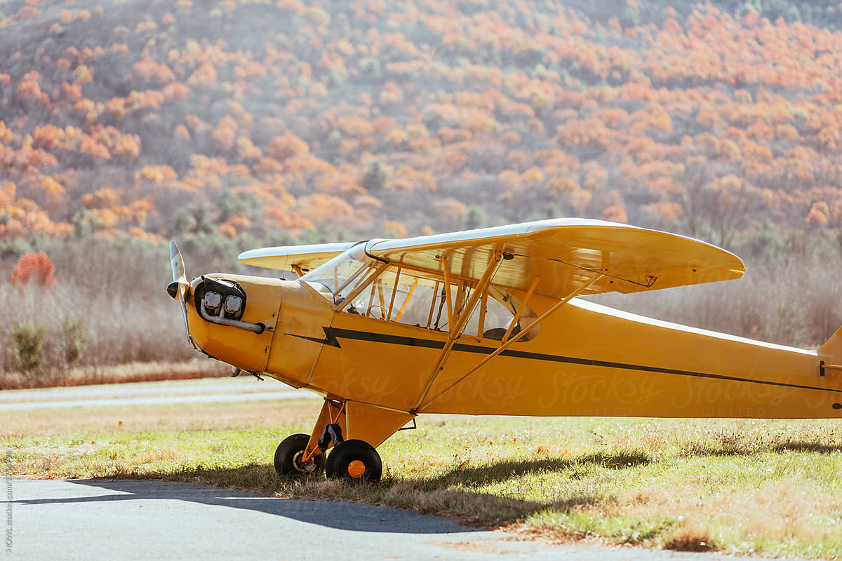 Cessna airplane in update New York with fall foliage