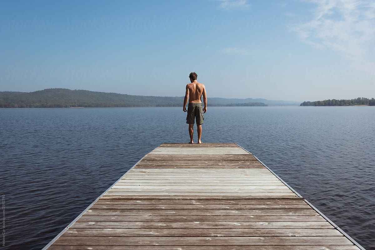 Man standing on dock