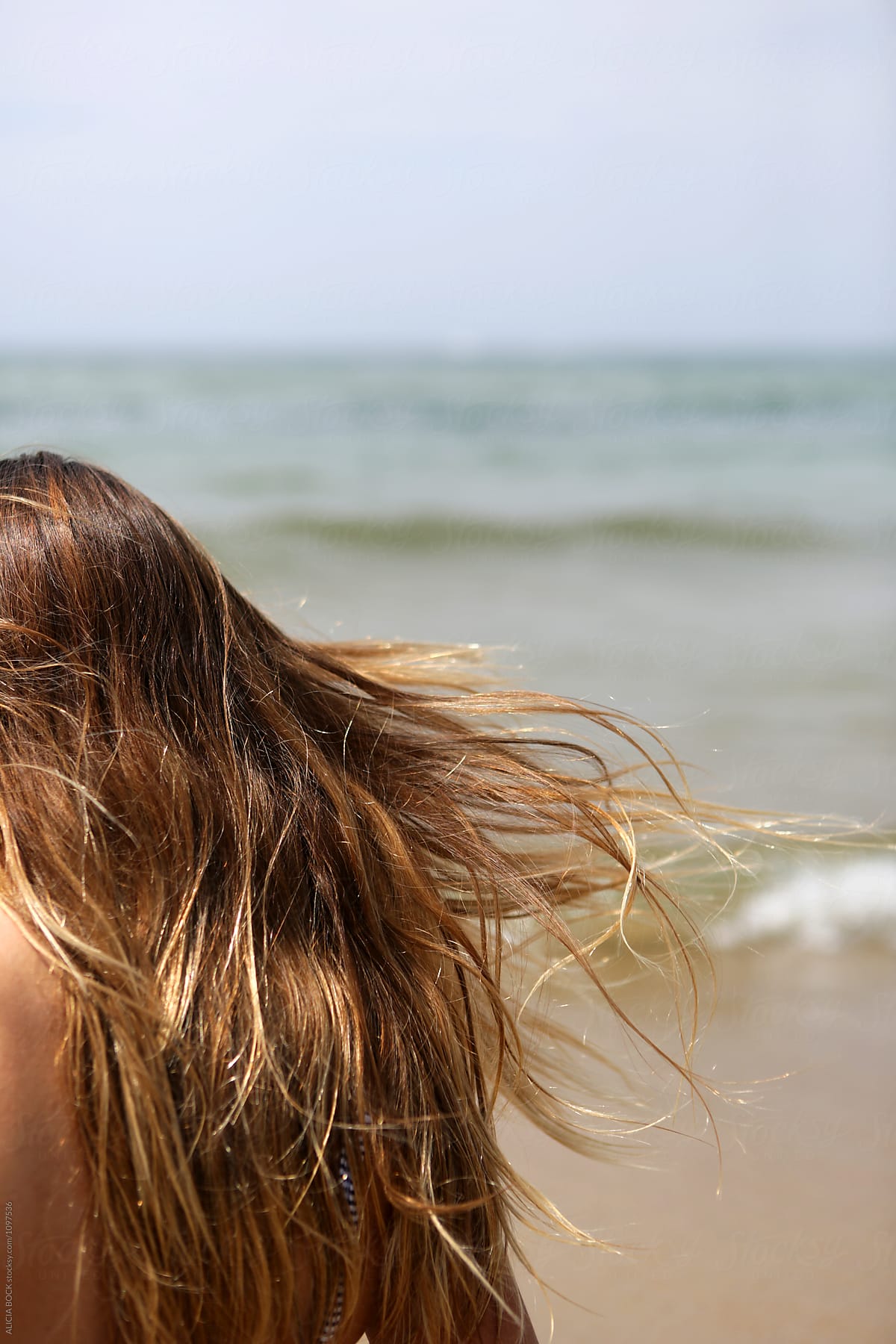 Close Up Of Beach Hair Blowing In The Wind