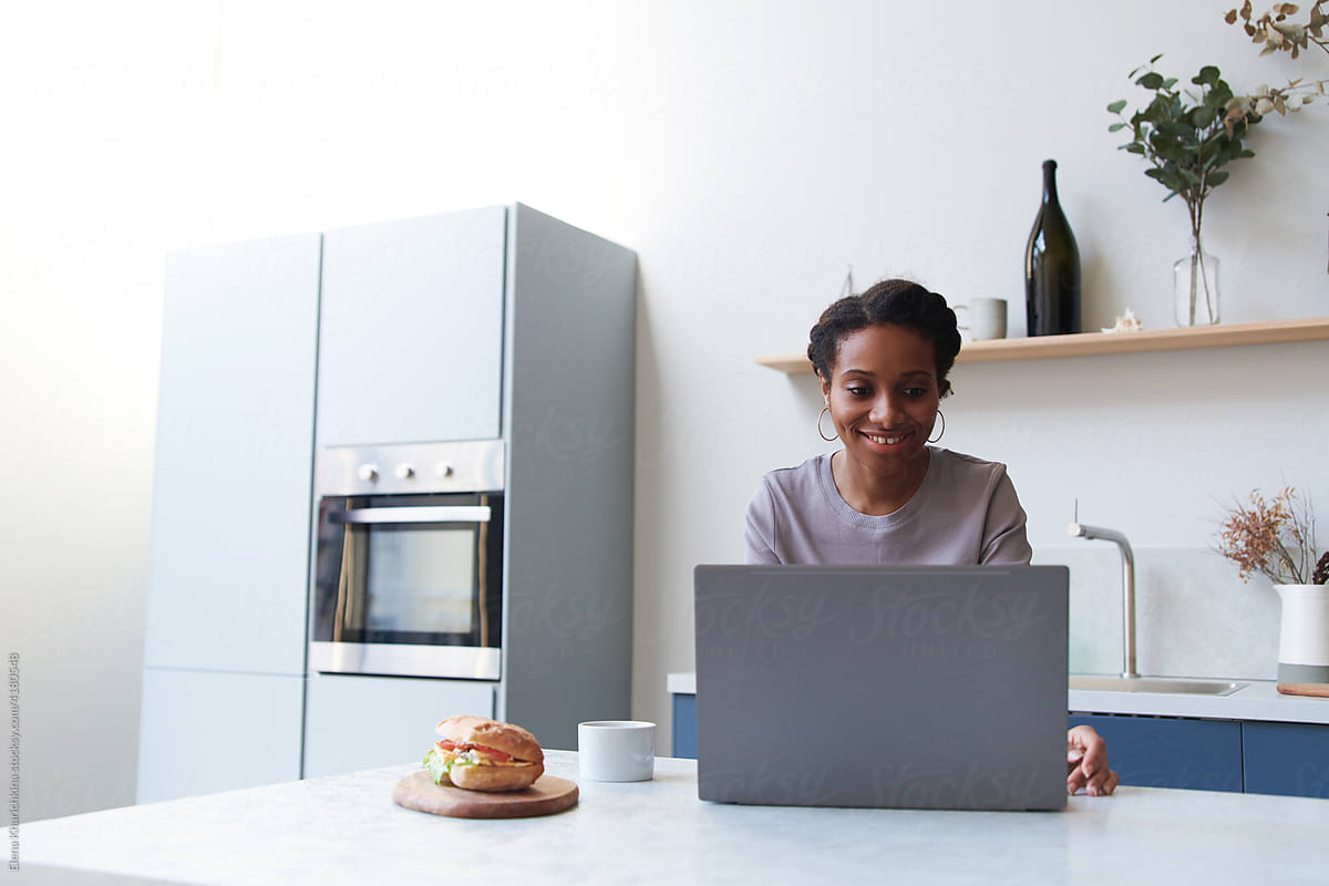 Young black woman working from home