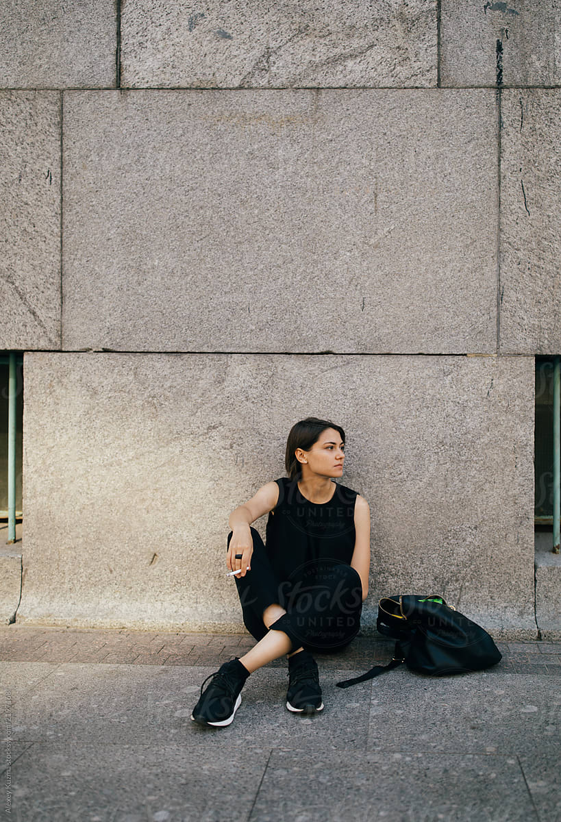 Portrait Of Real Lesbian Woman Smoking On The Street By Stocksy Contributor Alexey Kuzma