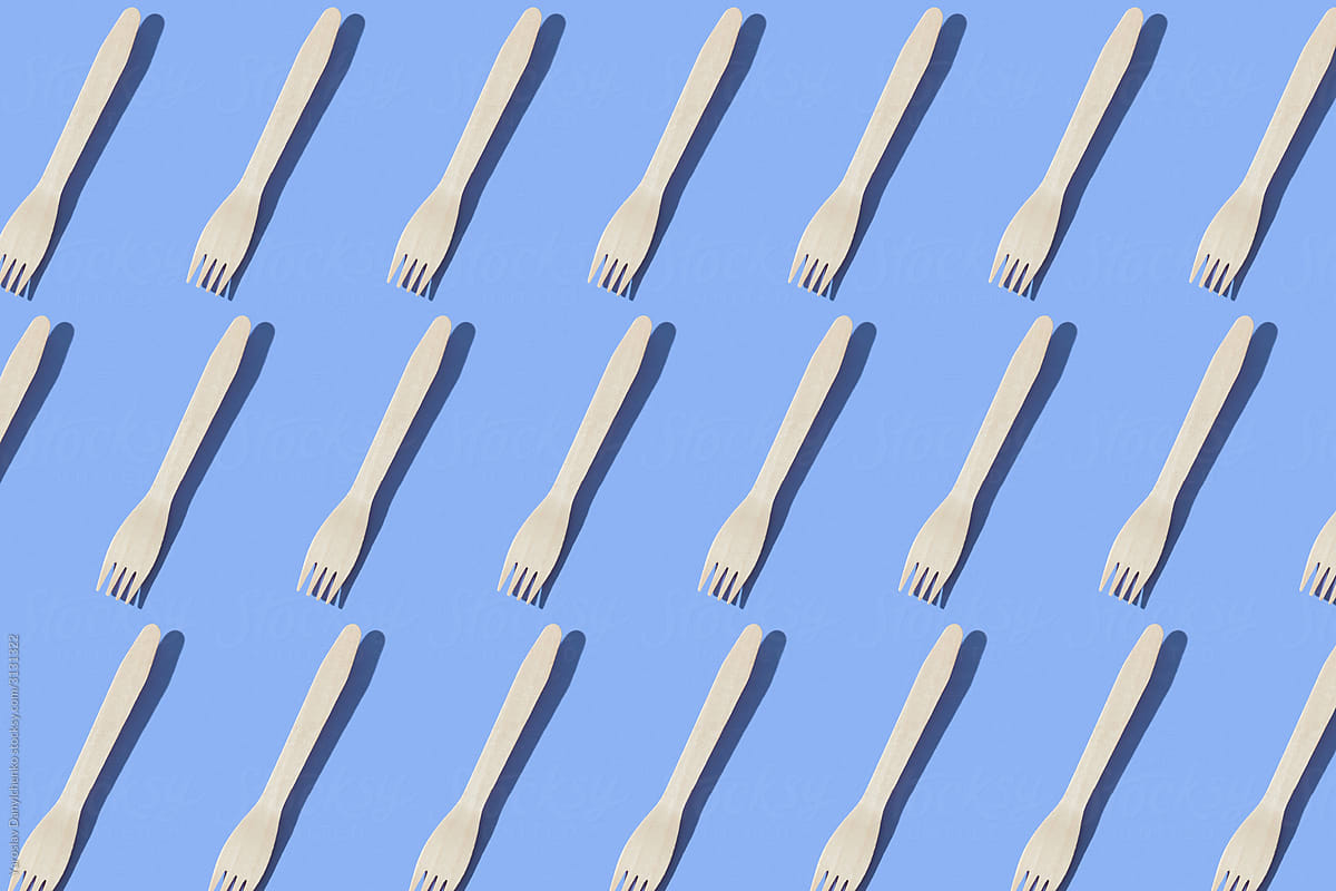 Wooden forks pattern with shadows.