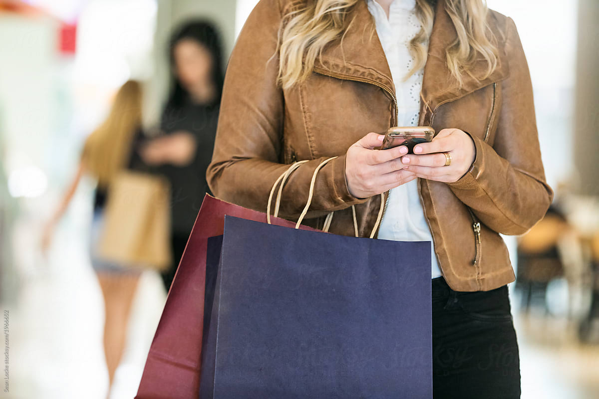 Mall: Woman With Shopping Bags Answering Text Message