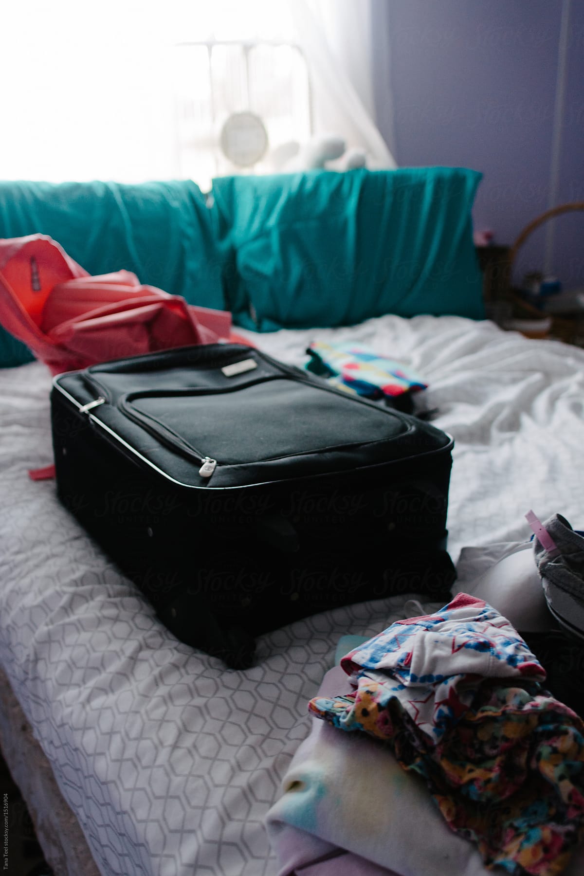 Packed Suitcase Sitting On Bed By Stocksy Contributor Tana Teel Stocksy