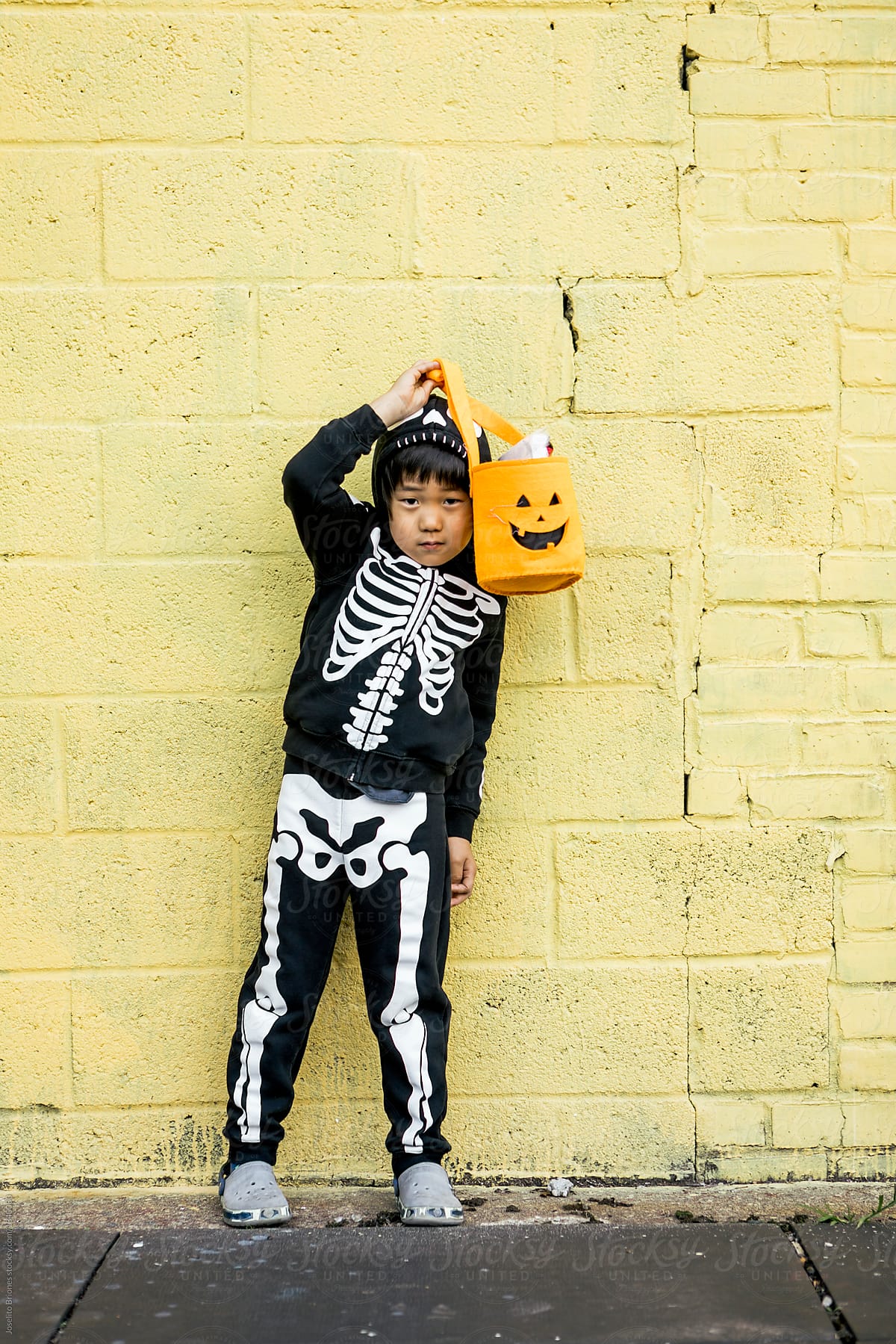 Asian Boy in Halloween Skeleton Costume