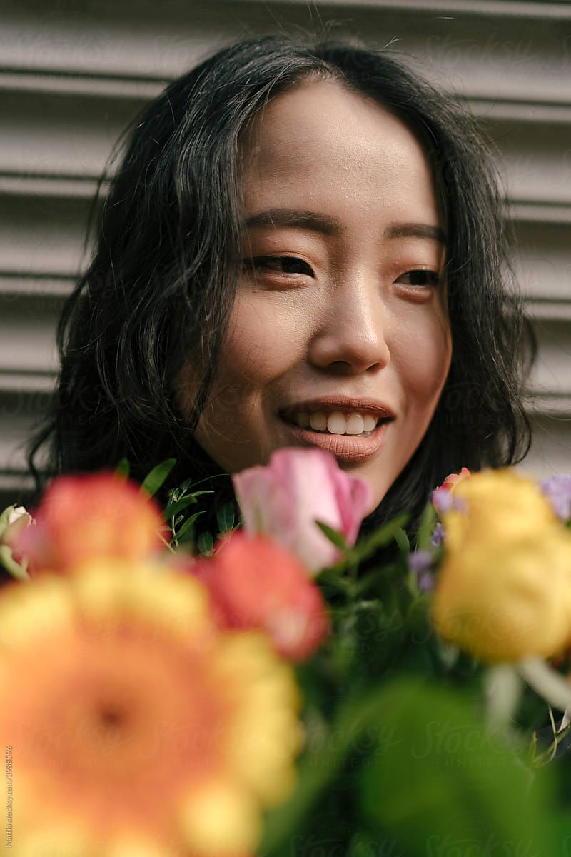 Portrait of an Asian Woman with Flowers