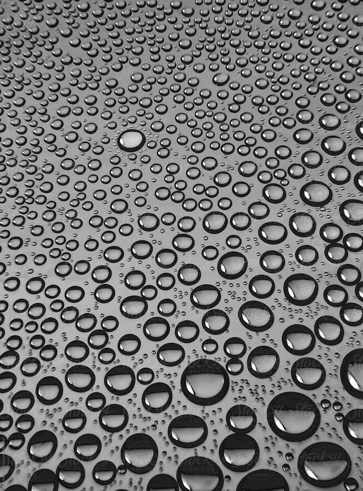 Closeup microphotograph of water condensation inside a plastic bottle