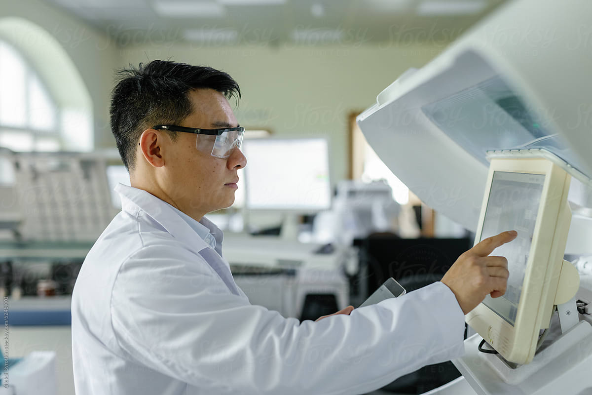 investigator browsing digital monitor computer biotechnology