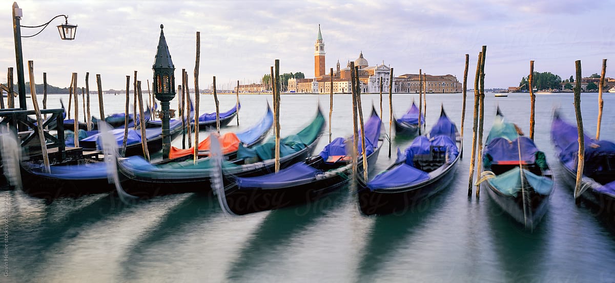 Gondolas moored with the island of San Giorgio Maggiore beyond, Venice, Veneto, Italy, Europe
