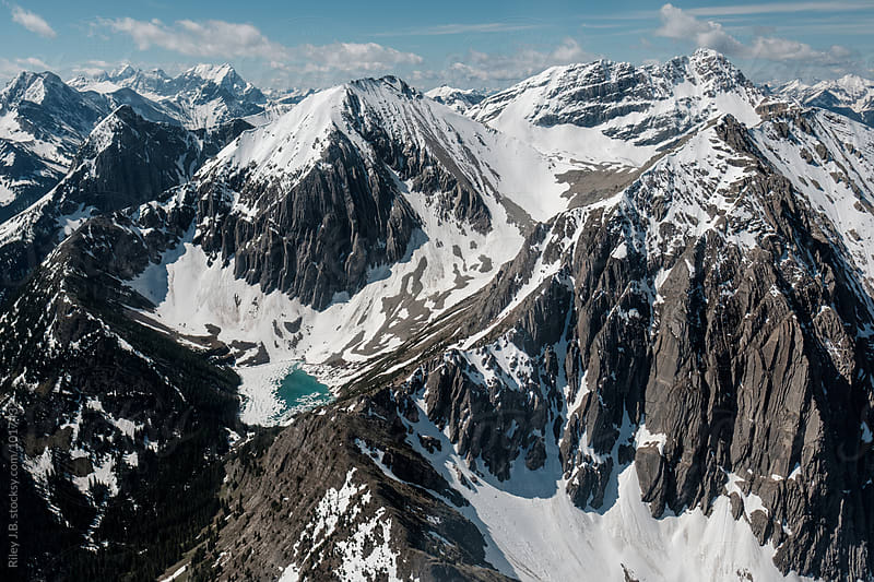 Vivid blue glacial lake at the bottom of a mountain