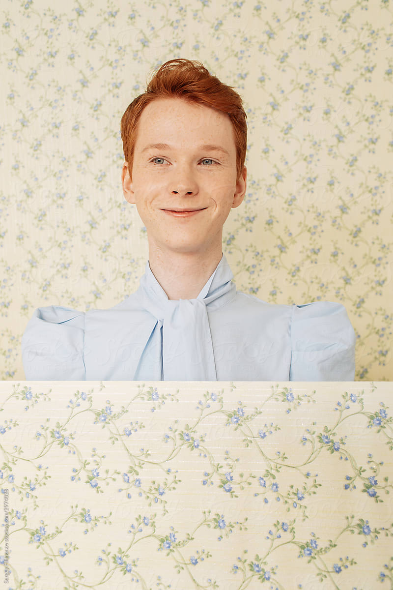 Positive ginger androgynous model in blue blouse