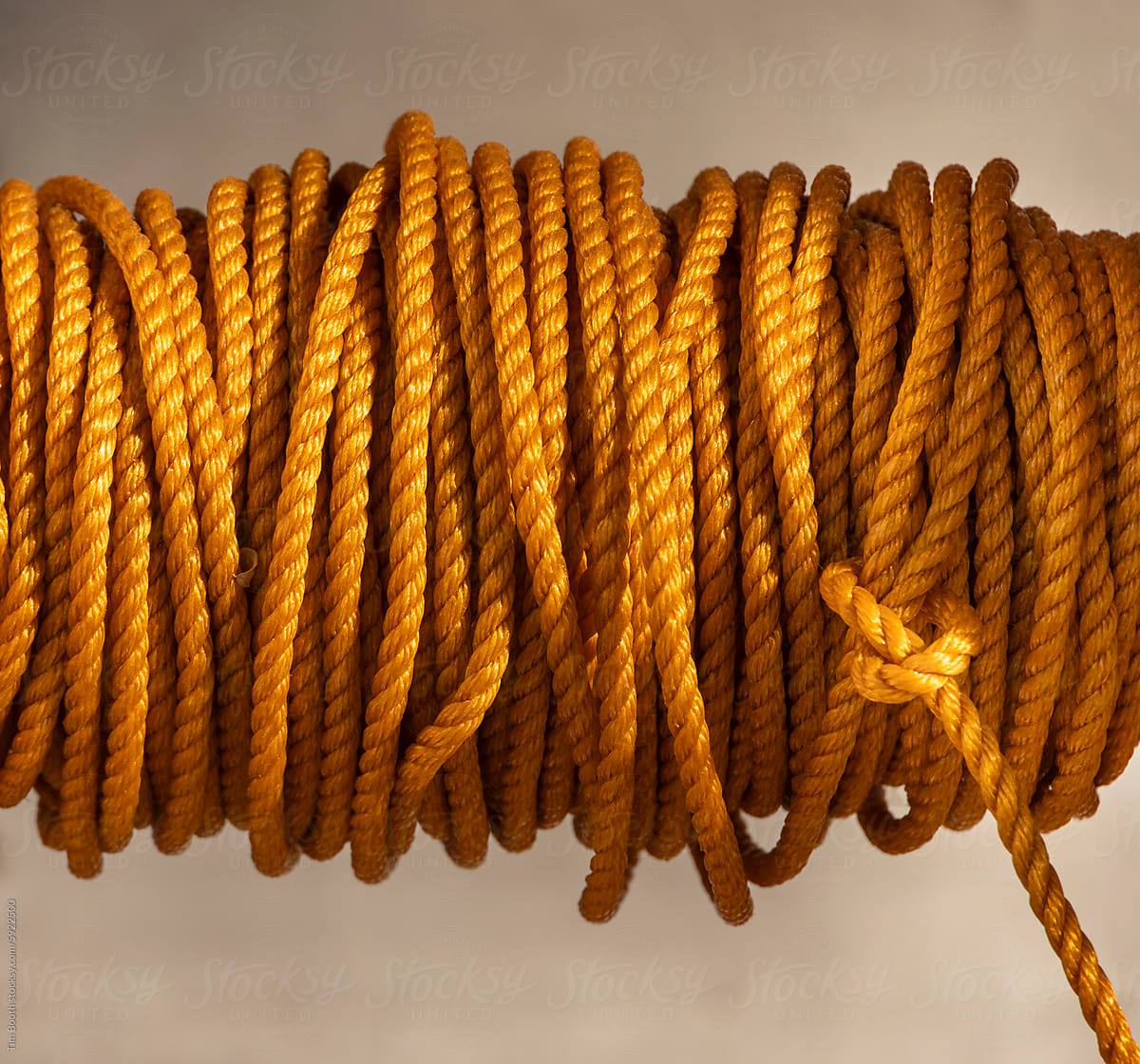 Close-up of a spool of orange cord