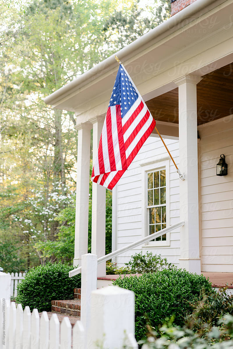 Southern front porch with American flag