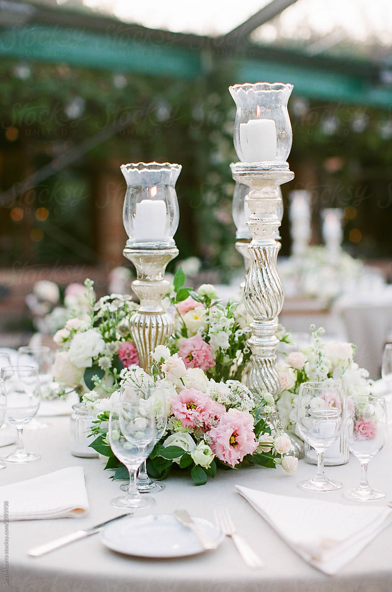 Elegant candles and floral arrangements at a wedding reception