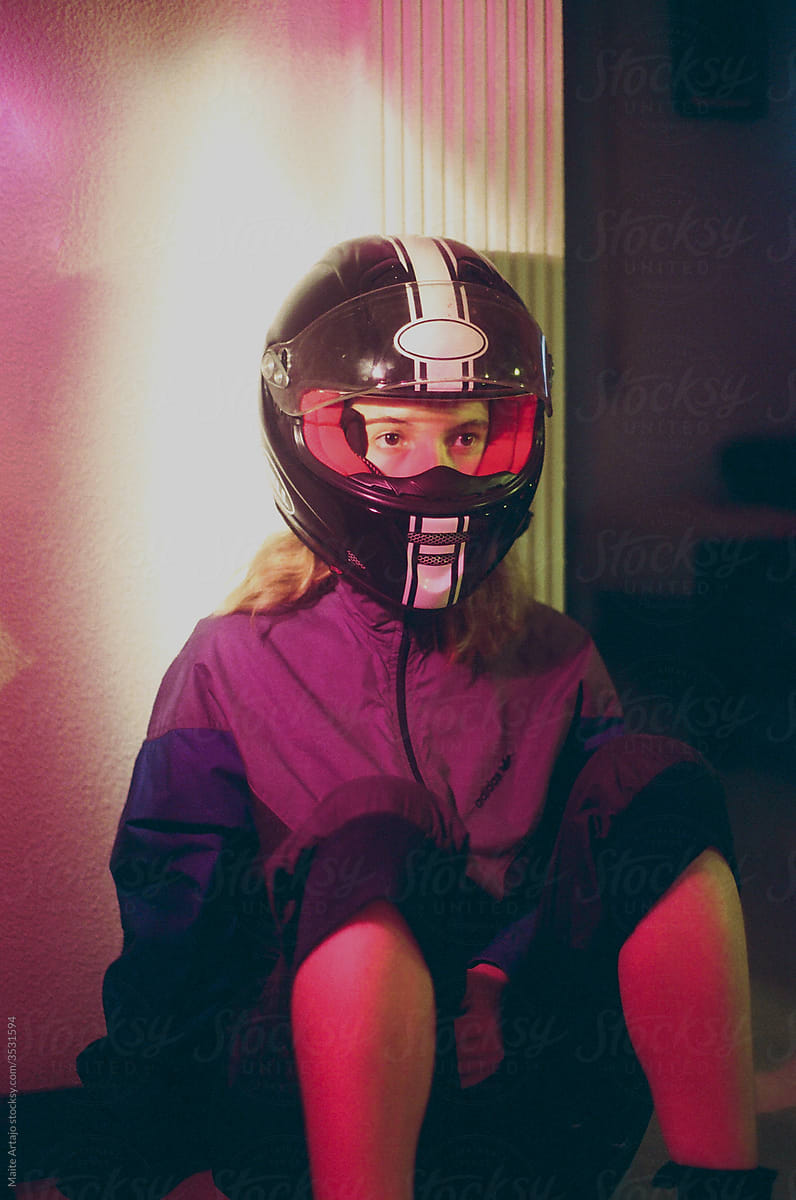 Girl with helmet and purple jumpsuit