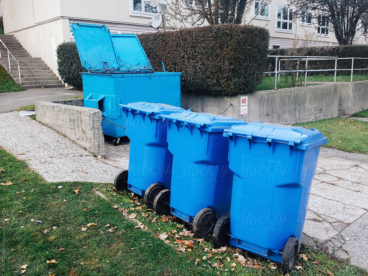 Blue trash bins in a row