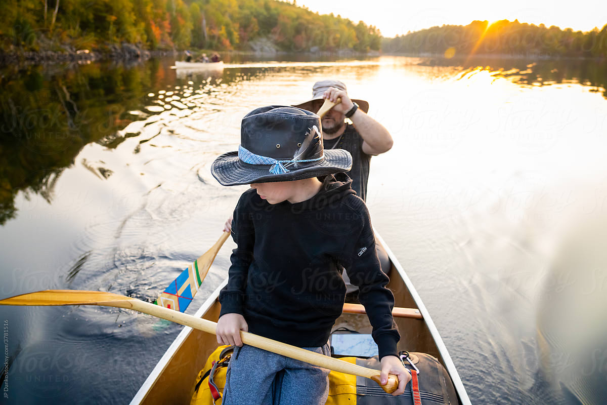 Father and Son Paddling Canoe on  Backcountry Canoe Trip