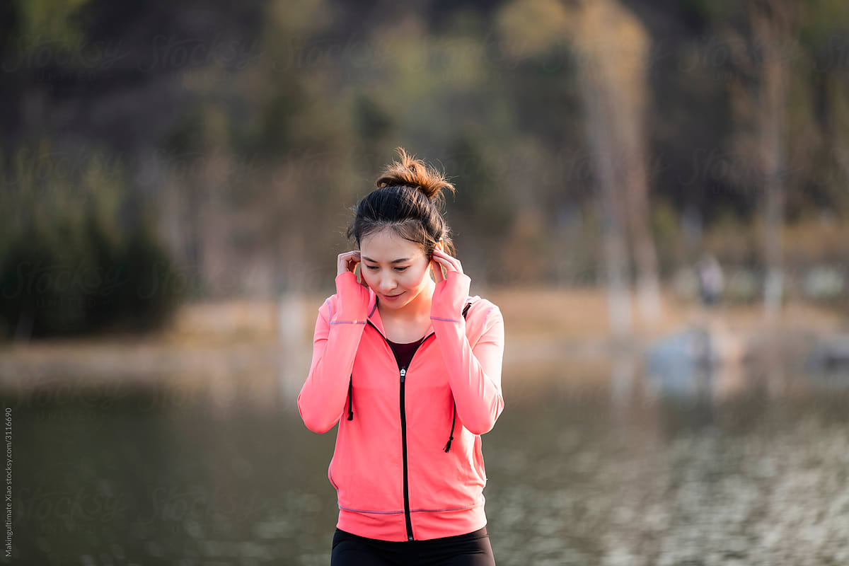 A beautiful Chinese woman doing fitness outdoors