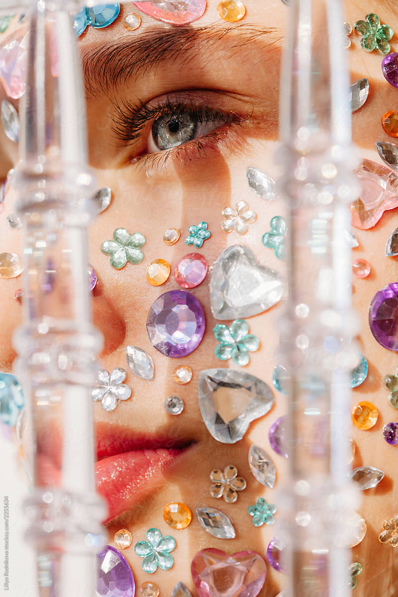 Closeup beauty portrait of face with crystals and transparent decor