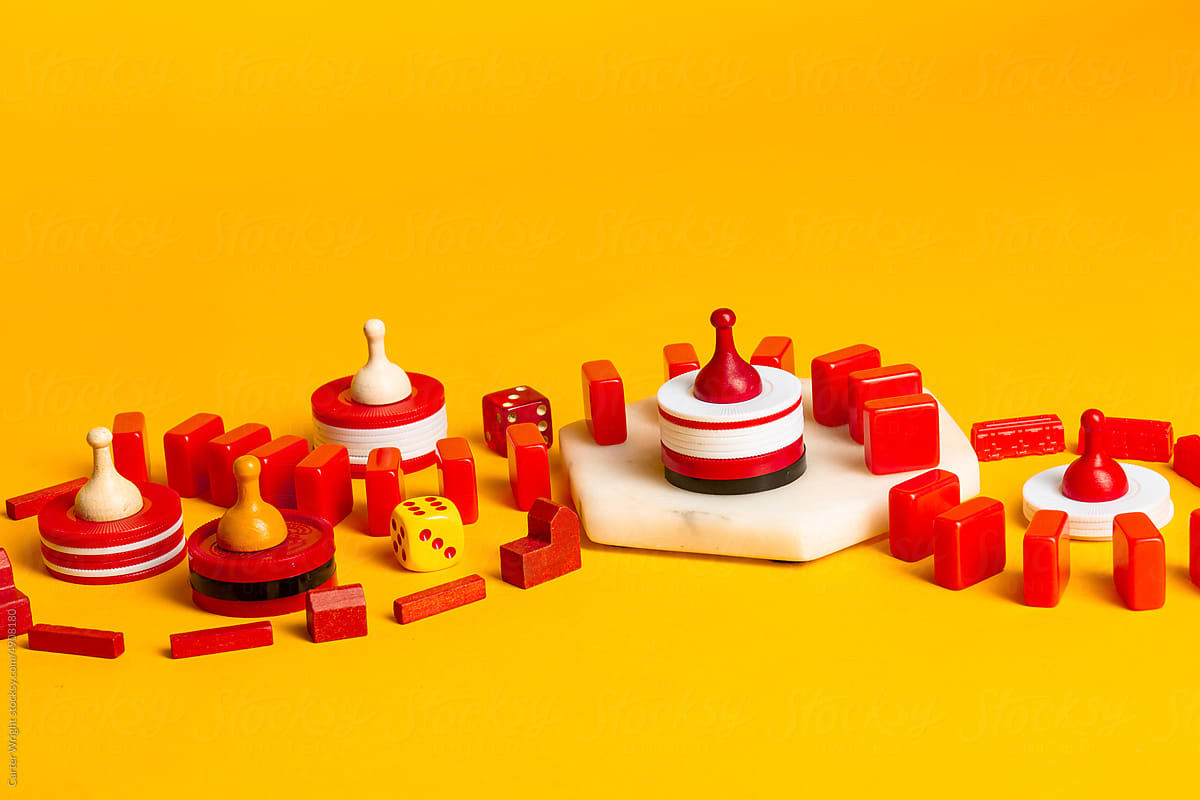 Red and yellow Board Game pieces and dice swirling