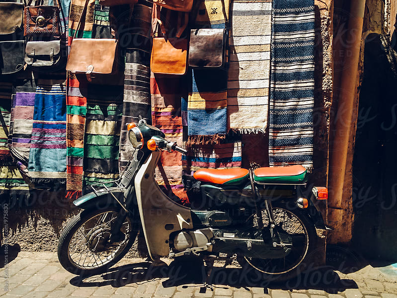 motorcycle by a carpet display in Marrakesh