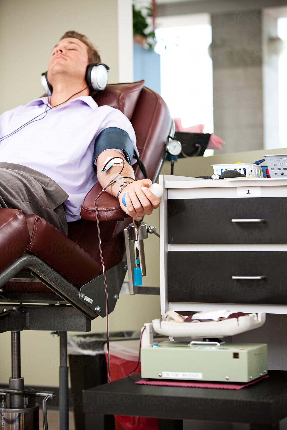 Blood Bank: Male Donor Rests While Giving Blood