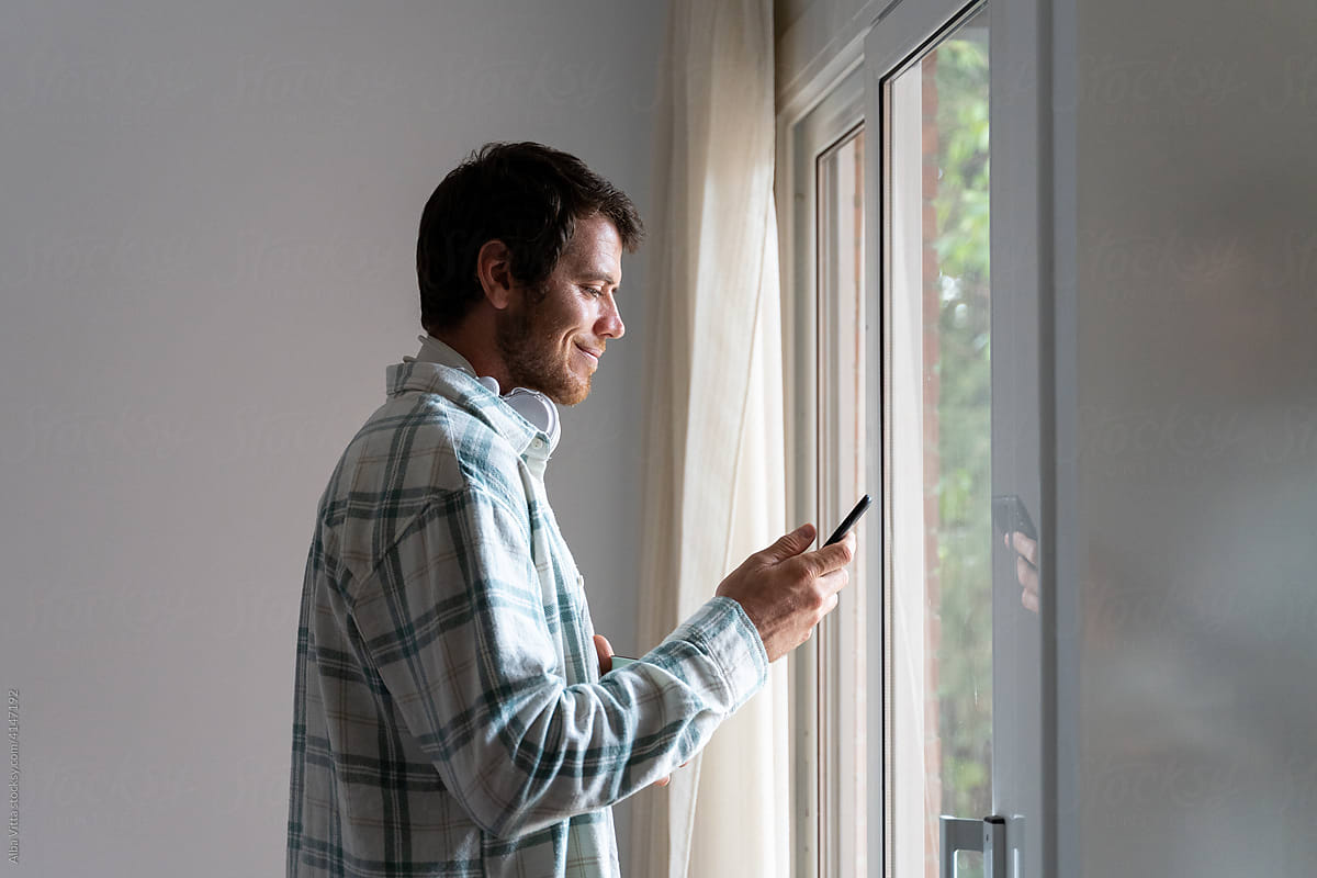 Man texting at home
