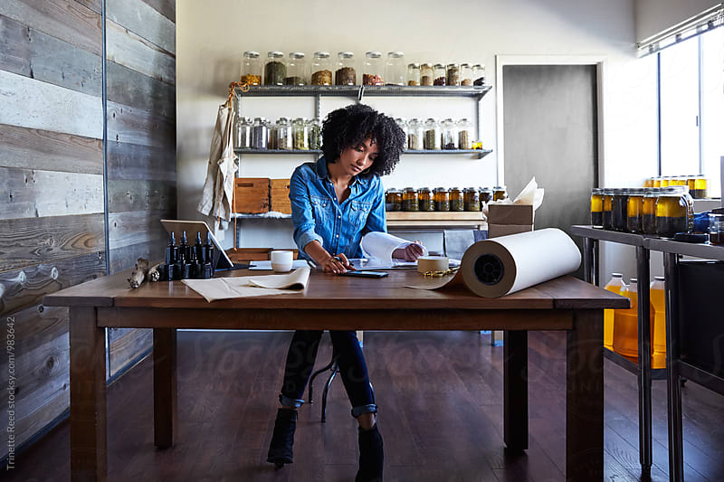 Millennial African American Woman businesswoman in her skincare studio