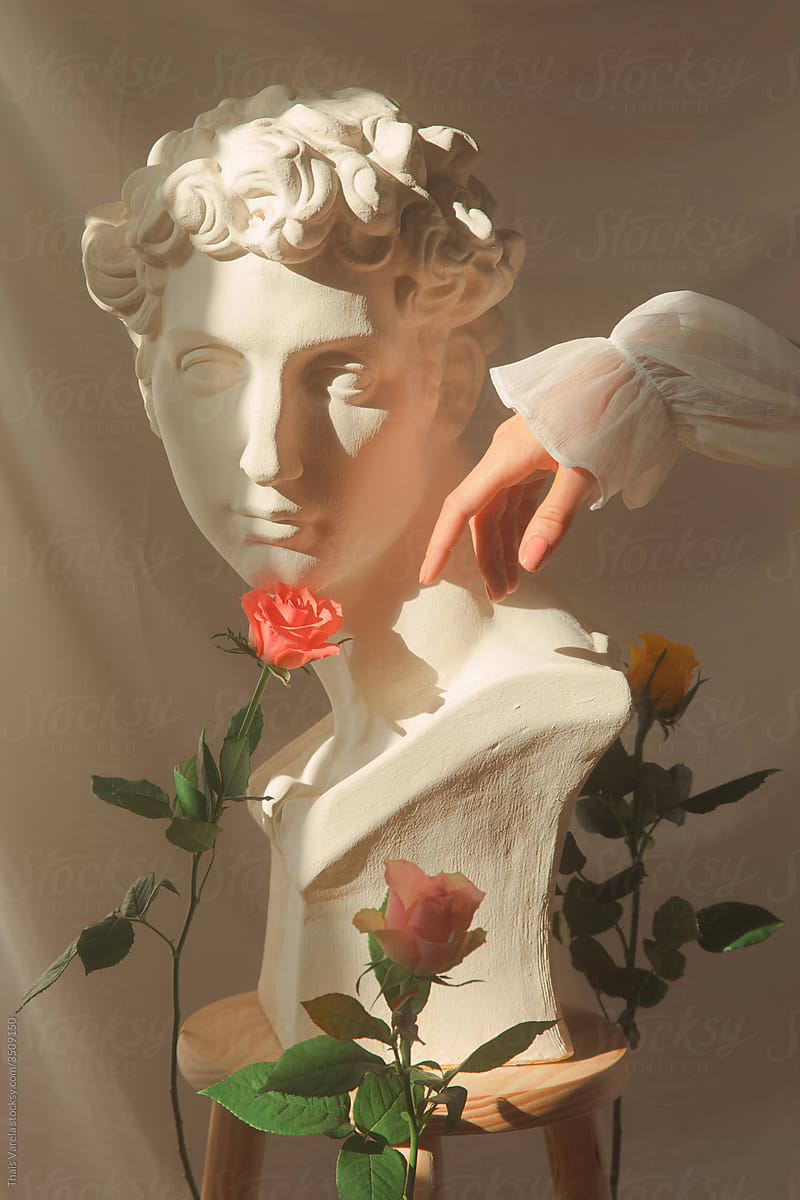 statue and roses.