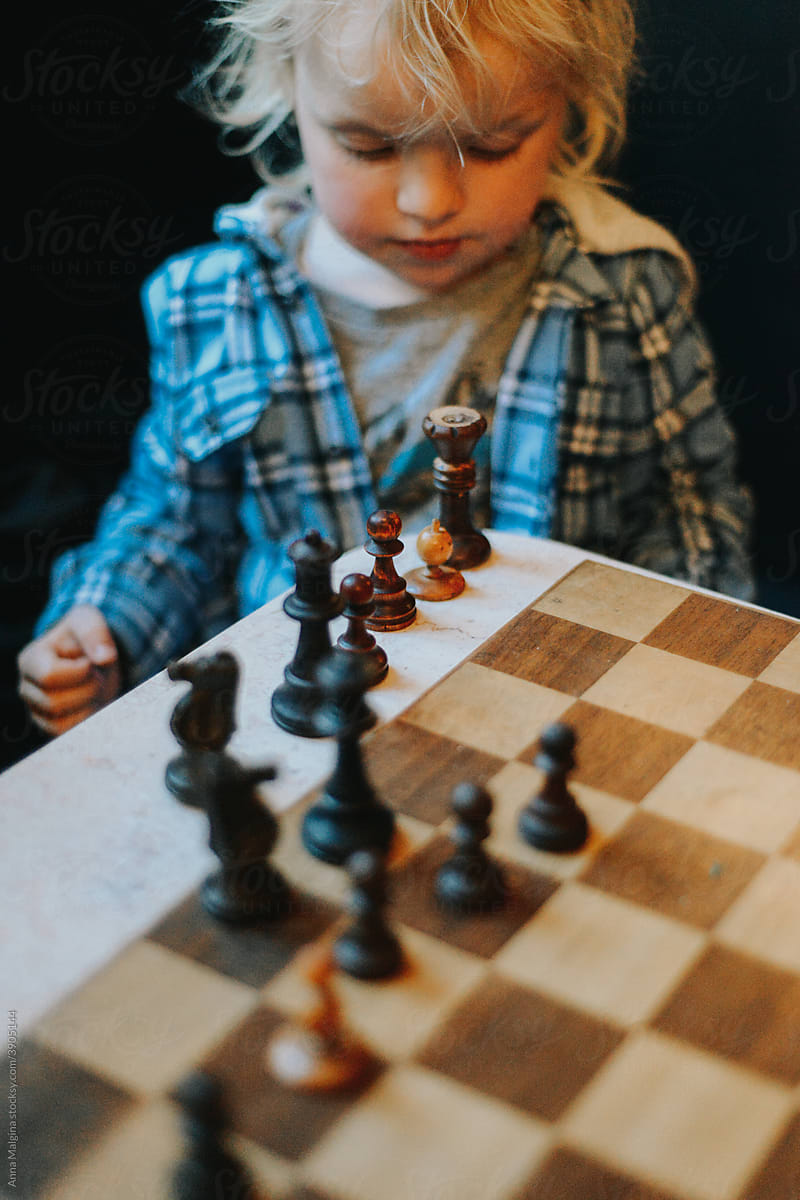 A toddler and chess table