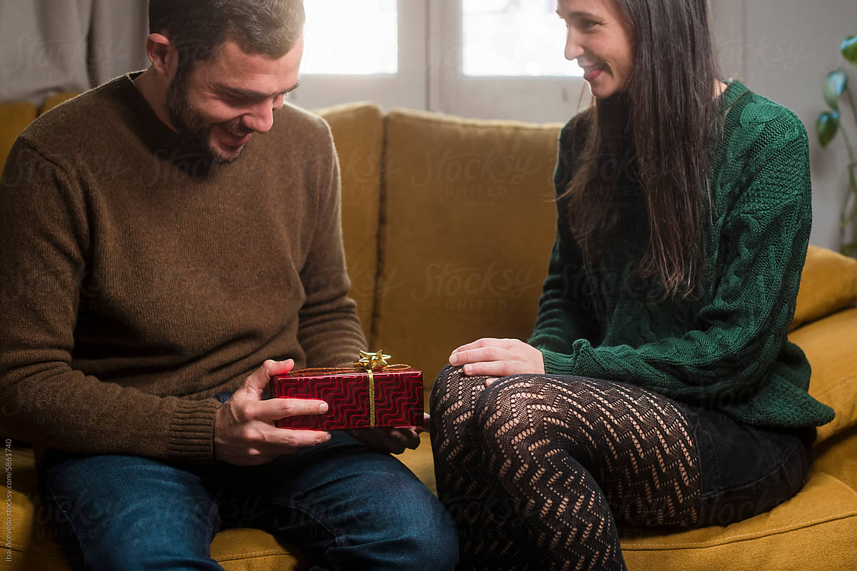 Couple enjoying gift giving emotion together