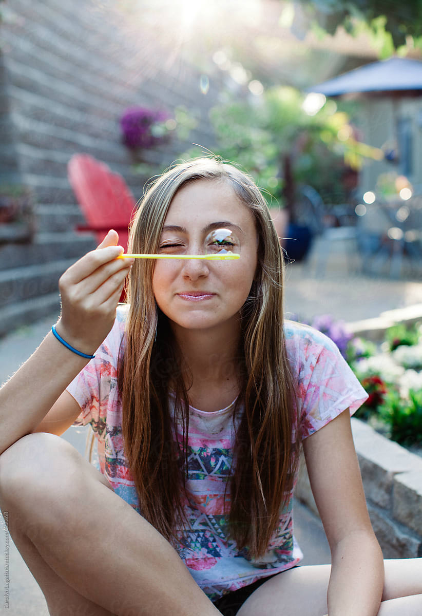 Teenage Girl Blowing Bubbles And Being Silly By Stocksy Contributor Carolyn Lagattuta Stocksy
