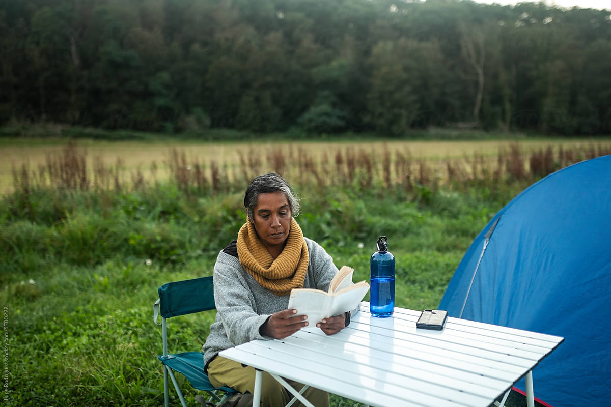 middle aged indian woman camping in nature