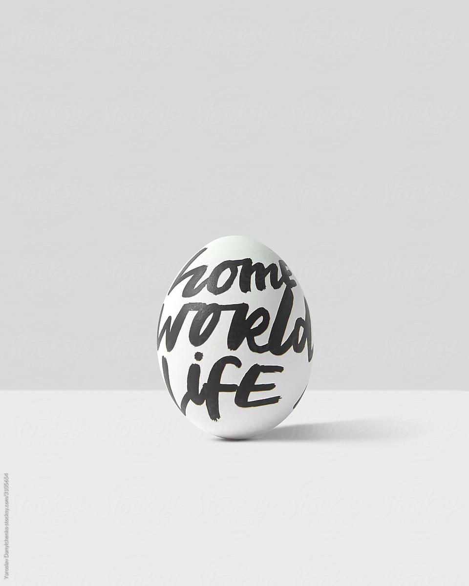 Easter egg with text - home, world, life.