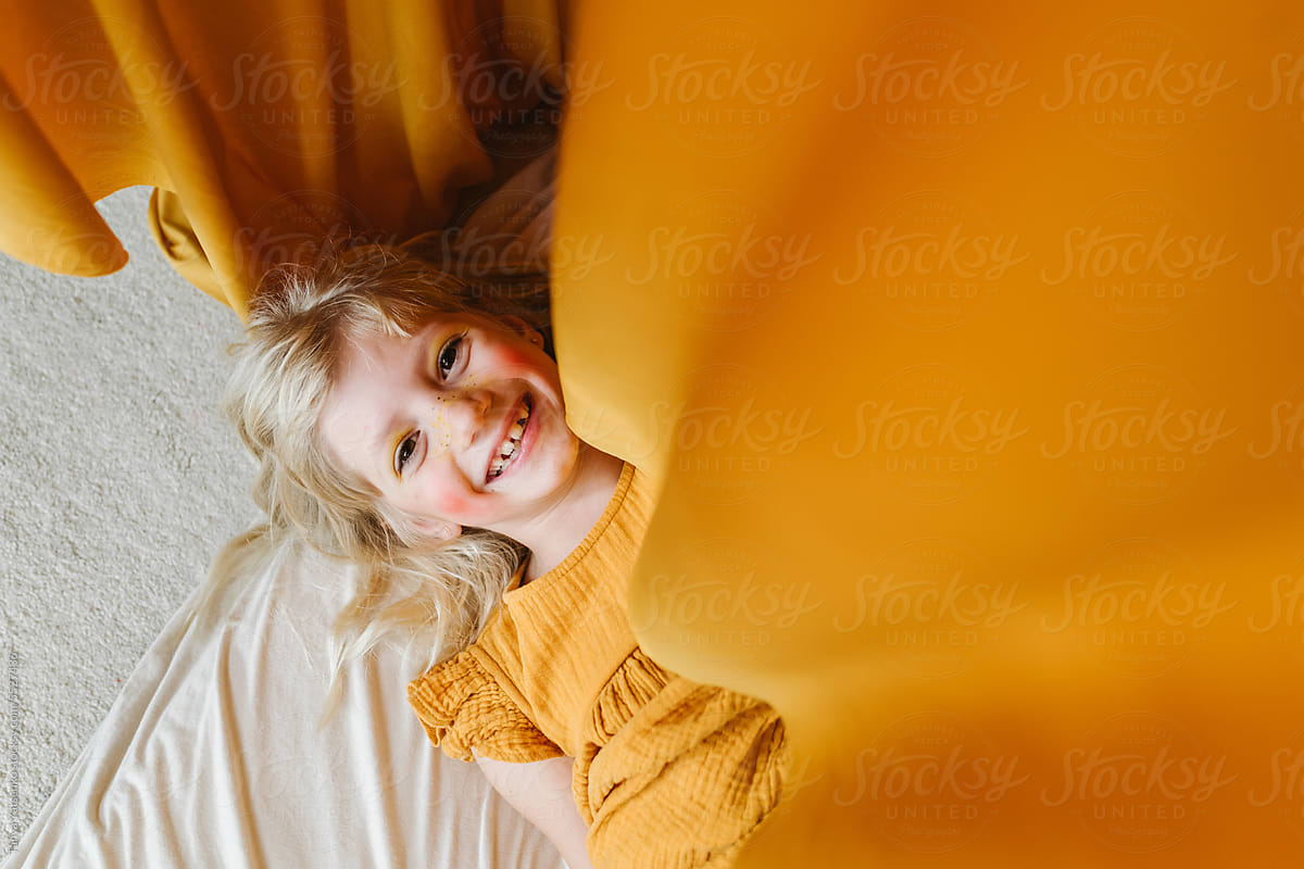 A happy girl in yellow dress