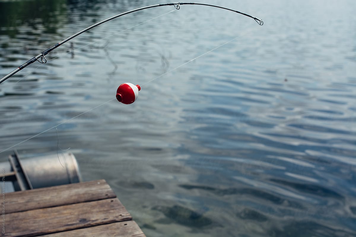 Fishing Pole Float by Stocksy Contributor Gabi Bucataru - Stocksy