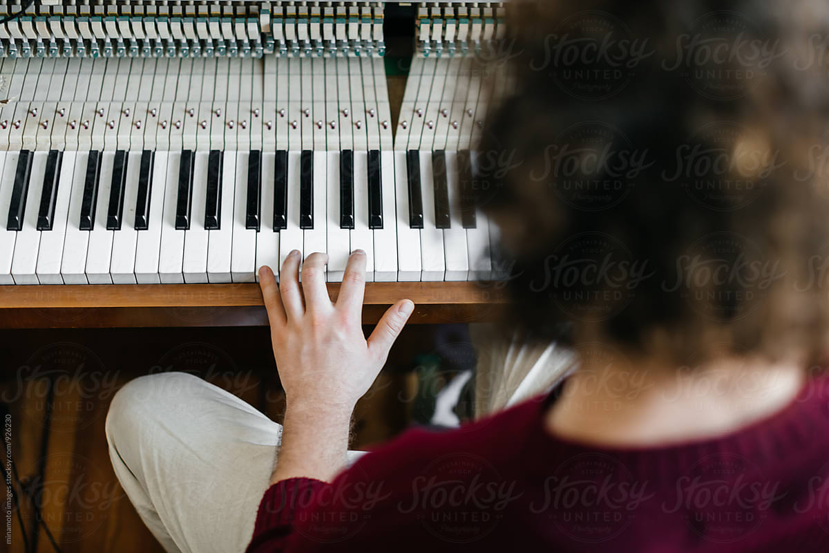 Young man playing the piano.