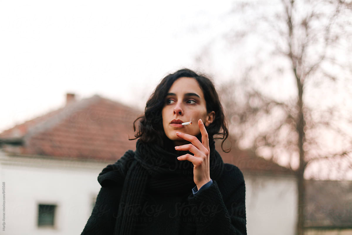 Beautiful Brunette Woman Smoking Cigarette By Marija Kovac